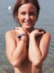 Cutie Anne shows off her tight body and she teases non nude down by the beach