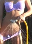 Kari sweets is having a hot summer as she cools down in the back garden with the sprinkler down her pants